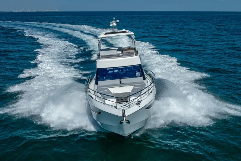  Yacht Photos Pics 2021 Galeon 500 Fly yacht cruising on open sea, creating dynamic water trails.