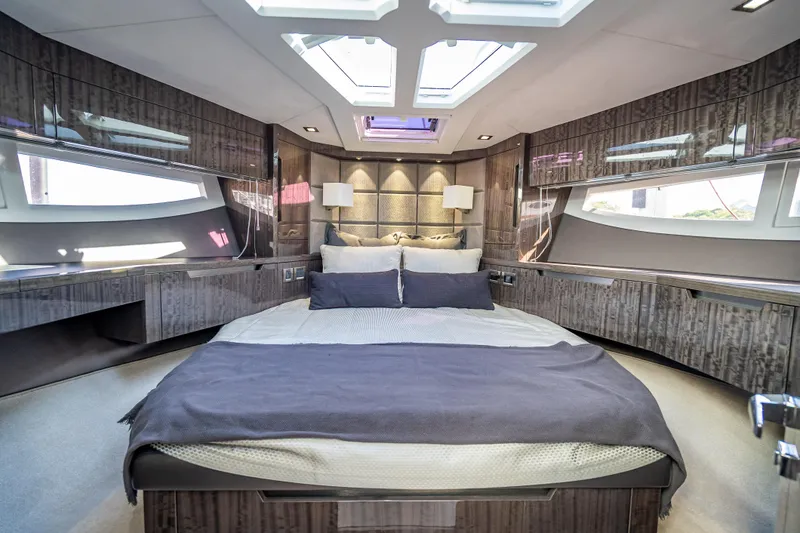  Yacht Photos Pics Luxurious bedroom interior of 2021 Galeon 500 Fly yacht with modern design and skylights.