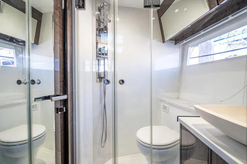 Yacht Photos Pics Modern bathroom in 2021 Galeon 500 Fly yacht with glass shower and sleek fixtures.