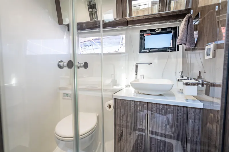 Yacht Photos Pics Luxurious bathroom in 2021 Galeon 500 Fly yacht with modern fixtures and elegant design.