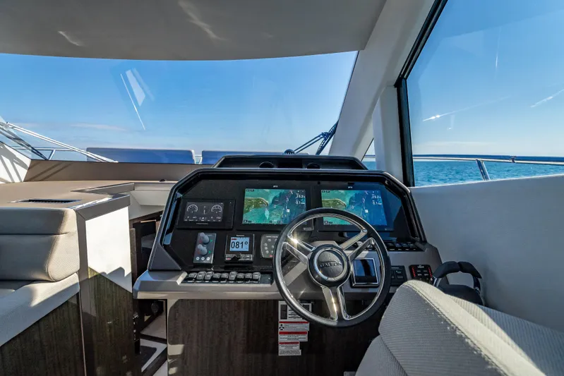  Yacht Photos Pics Helm of 2021 Galeon 500 Fly yacht with modern navigation displays and ocean view.