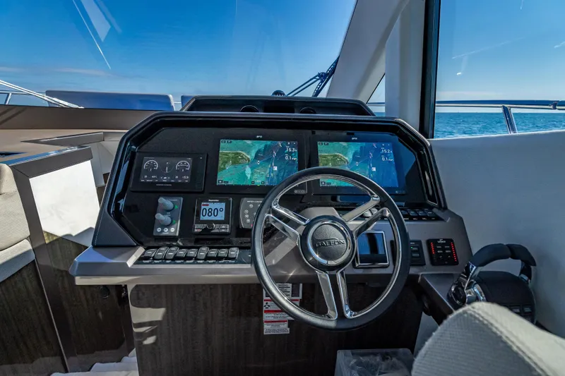  Yacht Photos Pics Cockpit of 2021 Galeon 500 Fly yacht with advanced navigation systems and steering wheel.