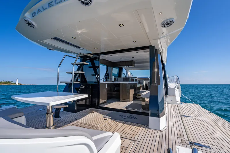  Yacht Photos Pics 2021 Galeon 500 Fly yacht with open deck, ocean view, and modern interior.