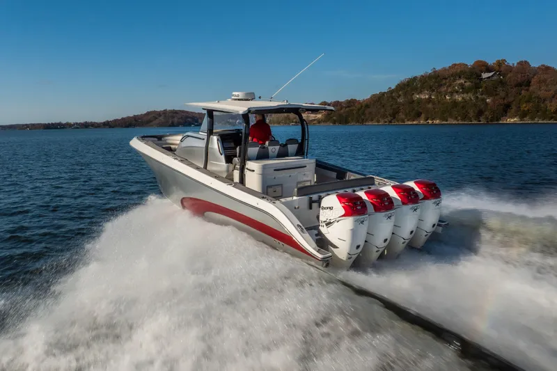  Yacht Photos Pics 2020 Fountain 43 NX boat speeding on a lake with four powerful engines.