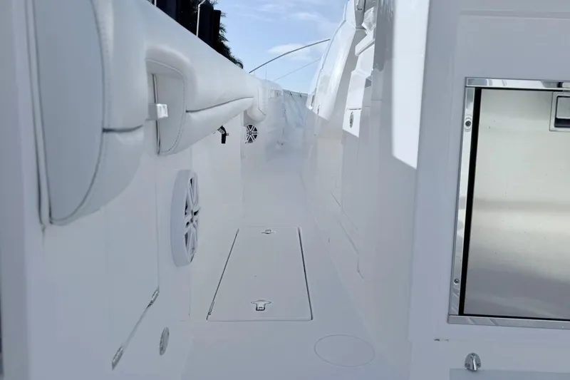  Yacht Photos Pics 2022 Intrepid 407 Panacea boat interior with sleek white design and modern features.