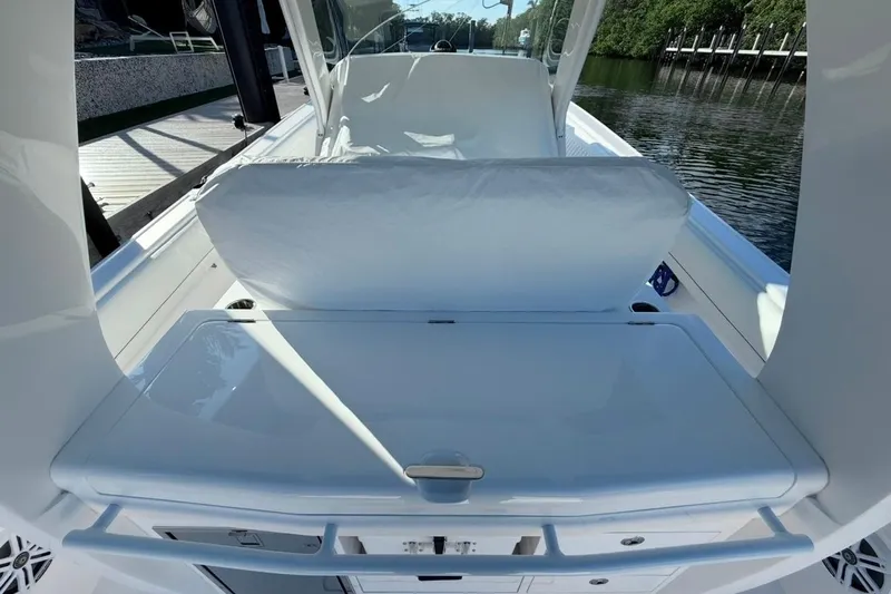  Yacht Photos Pics 2022 Intrepid 407 Panacea boat interior with sleek seating and storage area.