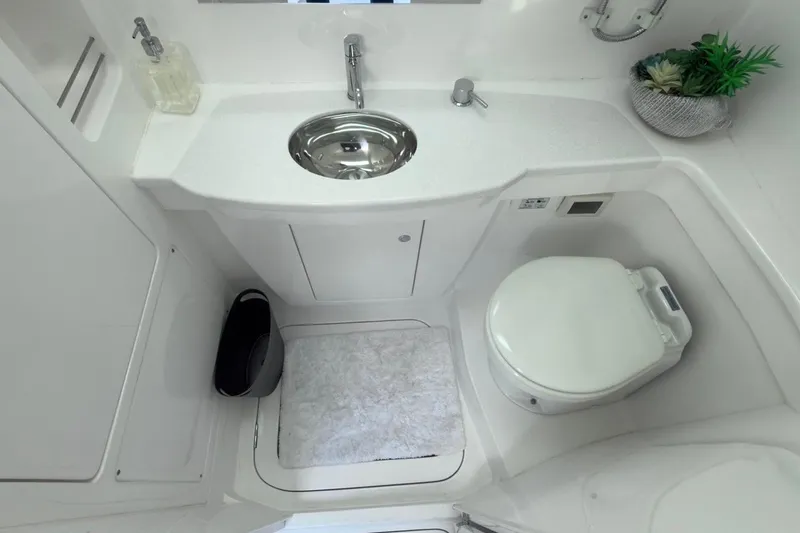  Yacht Photos Pics Luxurious bathroom in 2022 Intrepid 407 Panacea boat with modern fixtures and decor.