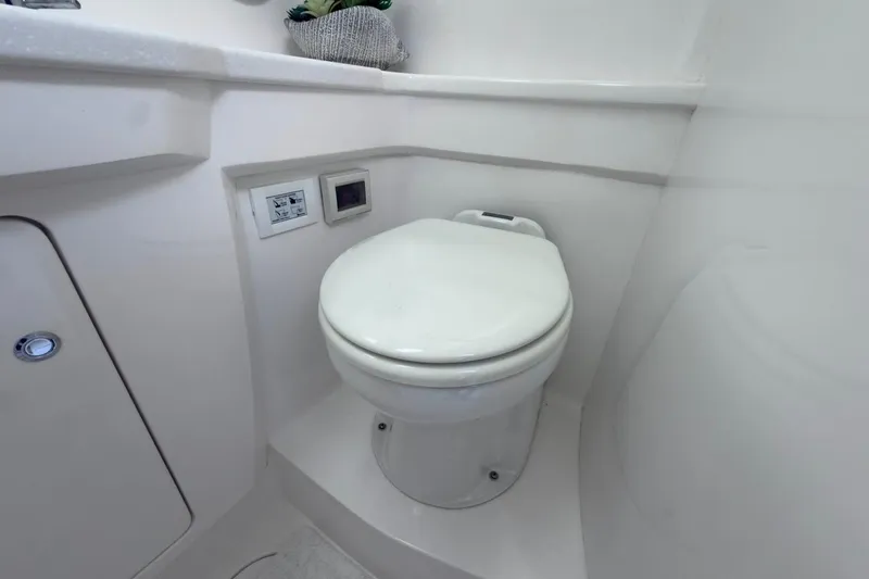  Yacht Photos Pics 2022 Intrepid 407 Panacea boat bathroom with modern white toilet and sleek design.