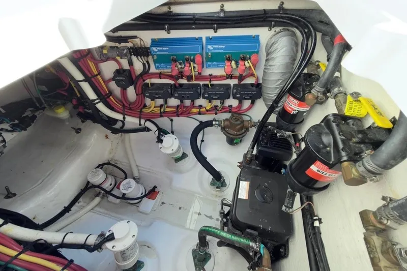  Yacht Photos Pics Engine room of 2022 Intrepid 407 Panacea with wiring and mechanical components.