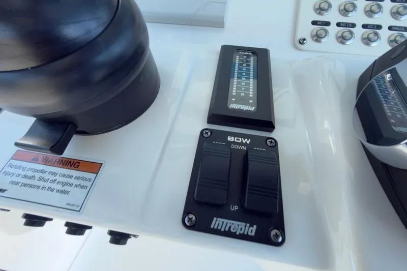  Yacht Photos Pics Control panel of 2022 Intrepid 407 Panacea boat with warning label and switches.