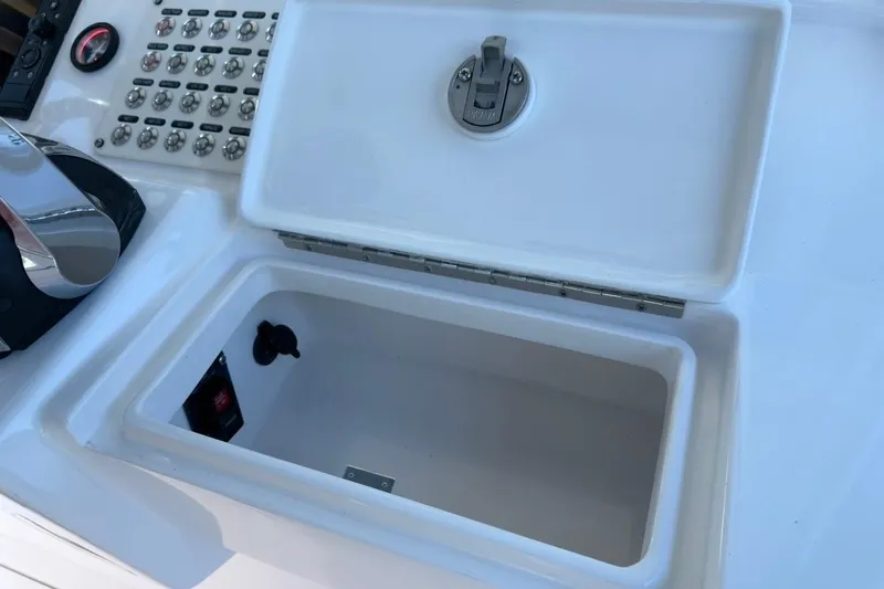 Yacht Photos Pics Control panel and storage compartment on 2022 Intrepid 407 Panacea boat.