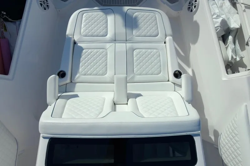  Yacht Photos Pics Luxurious white seating on 2022 Intrepid 407 Panacea boat, featuring quilted upholstery.
