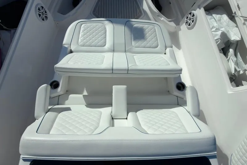  Yacht Photos Pics Luxurious seating on 2022 Intrepid 407 Panacea boat, featuring white quilted upholstery.