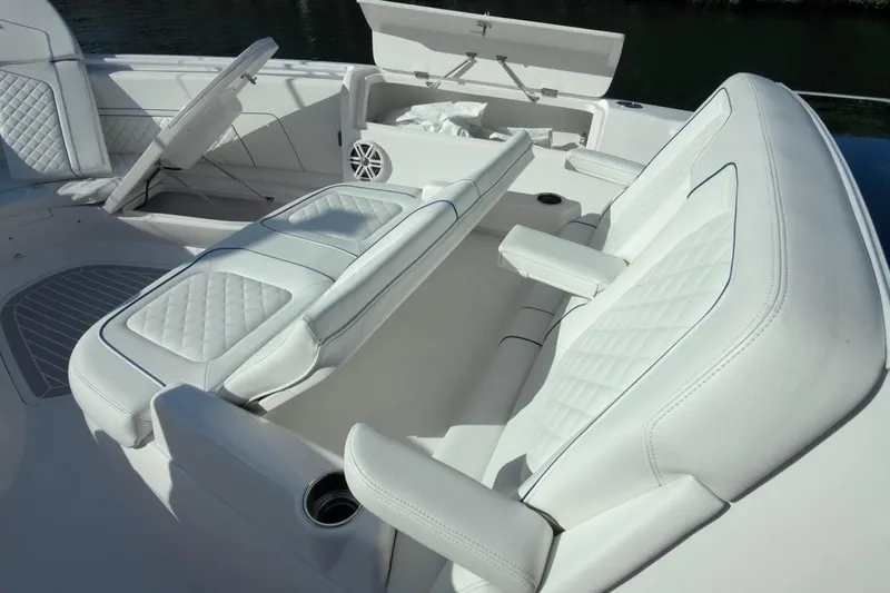  Yacht Photos Pics Luxurious seating on 2022 Intrepid 407 Panacea boat with white quilted upholstery.