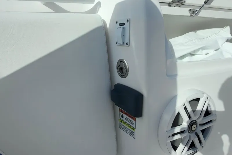  Yacht Photos Pics 2022 Intrepid 407 Panacea boat interior, featuring speaker and storage compartment.