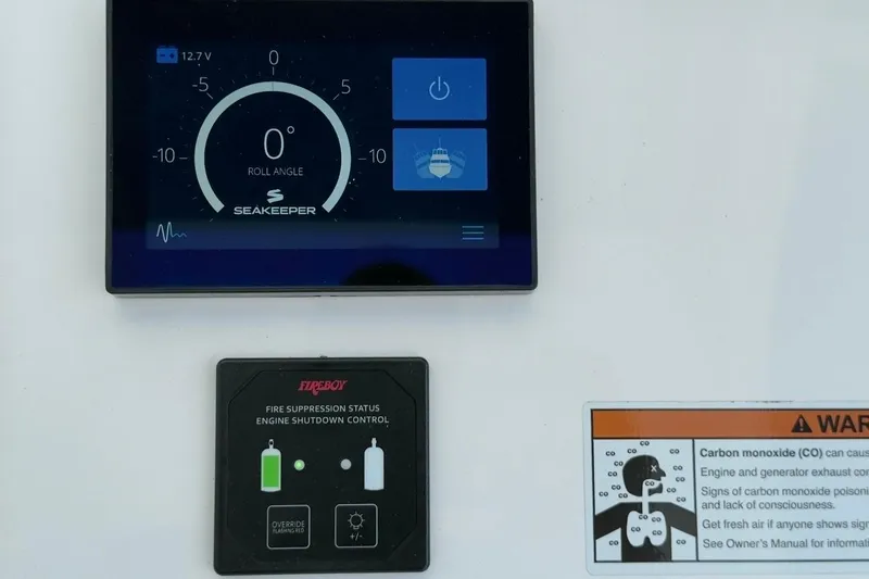  Yacht Photos Pics Control panel of 2022 Intrepid 407 Panacea with Seakeeper and Fireboy systems.