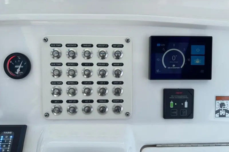  Yacht Photos Pics Control panel of 2022 Intrepid 407 Panacea boat with switches and digital display.