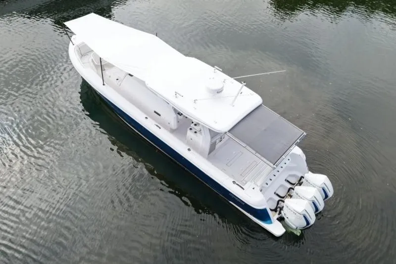  Yacht Photos Pics Aerial view of 2022 Intrepid 407 Panacea boat with triple outboard engines.