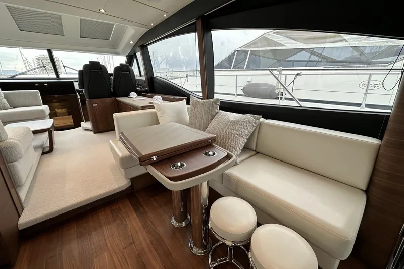  Yacht Photos Pics Luxurious interior of 2023 Princess S62 yacht with elegant seating and modern design.
