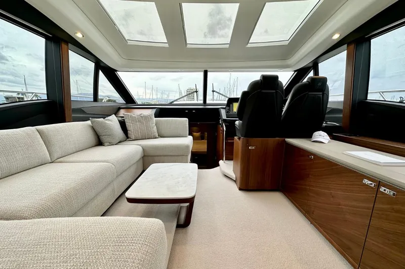  Yacht Photos Pics Luxurious interior of 2023 Princess S62 yacht with plush seating and modern design.