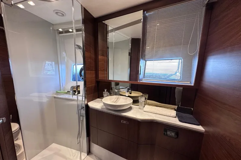  Yacht Photos Pics Luxurious bathroom in 2023 Princess S62 yacht with modern fixtures and elegant design.