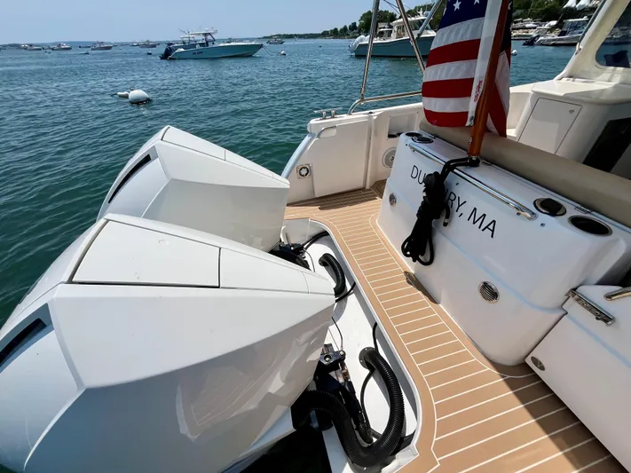 Waterlee Yacht Photos Pics 2019 MJM 35z boat with dual engines, docked in Duxbury, MA, featuring an American flag.