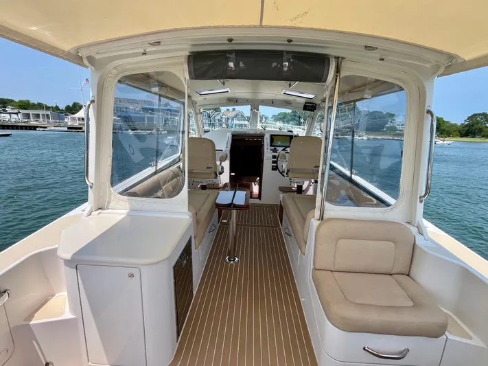 Waterlee Yacht Photos Pics Interior view of a 2019 MJM 35z boat with seating and helm.