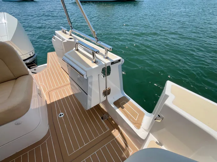 Waterlee Yacht Photos Pics 2019 MJM 35z boat deck with tan seating and swim platform on calm water.