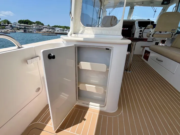 Waterlee Yacht Photos Pics Open storage compartment on 2019 MJM 35z boat, featuring sleek interior and waterfront view.