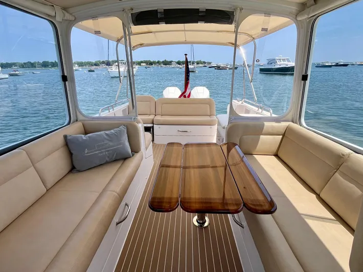 Waterlee Yacht Photos Pics Spacious interior of 2019 MJM 35z yacht with elegant seating and wooden table.