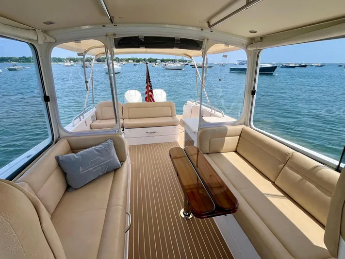 Waterlee Yacht Photos Pics Luxurious interior of 2019 MJM 35z yacht with beige seating and wooden flooring.