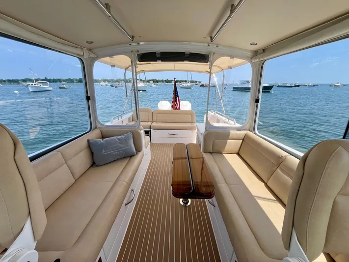 Waterlee Yacht Photos Pics Luxurious interior of 2019 MJM 35z yacht with beige seating and scenic ocean view.