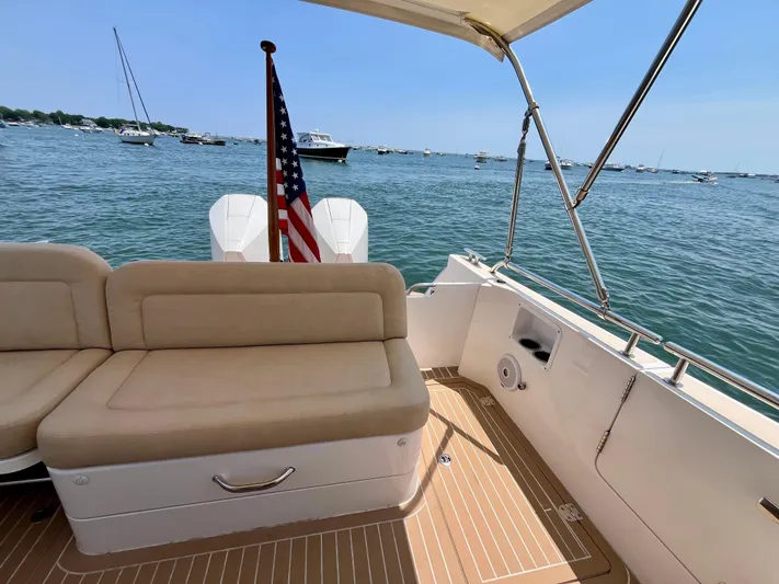 Waterlee Yacht Photos Pics 2019 MJM 35z boat interior with beige seating, American flag, and ocean view.
