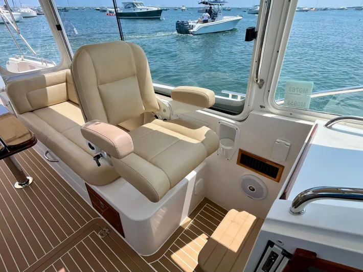 Waterlee Yacht Photos Pics Interior of 2019 MJM 35z boat with beige seating and ocean view.