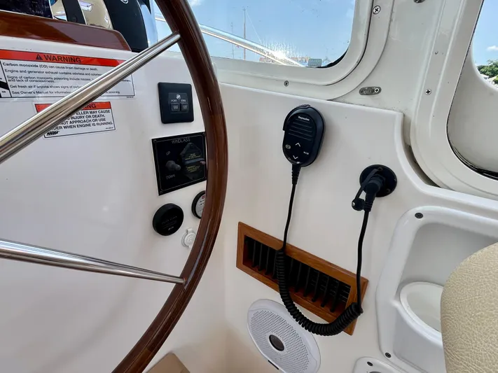 Waterlee Yacht Photos Pics Helm of 2019 MJM 35z boat with steering wheel and communication equipment.