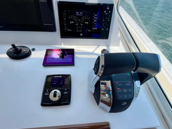 Waterlee Yacht Photos Pics Helm controls of a 2019 MJM 35z boat with navigation display.