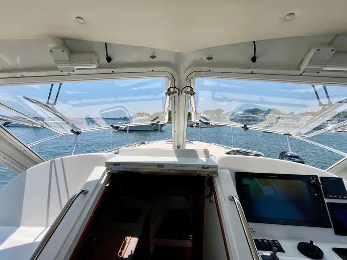 Waterlee Yacht Photos Pics 2019 MJM 35z yacht cockpit with open windows, overlooking a serene waterfront view.