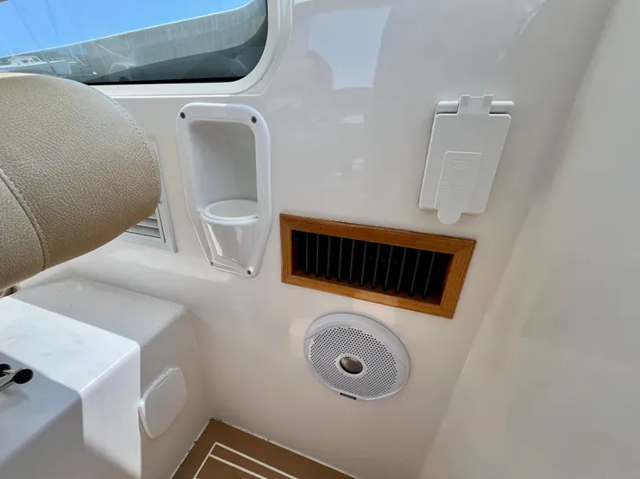 Waterlee Yacht Photos Pics Interior of a 2019 MJM 35z boat showing a vent, speaker, and cup holder.