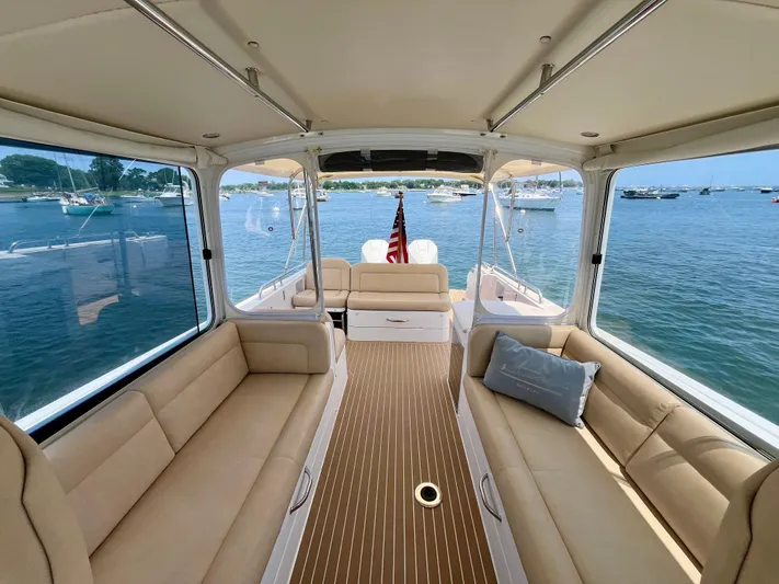 Waterlee Yacht Photos Pics Luxurious 2019 MJM 35z boat interior with beige seating, overlooking serene waters.