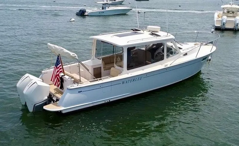 Waterlee Yacht Photos Pics 2019 MJM 35z boat on water, featuring sleek design and American flag.