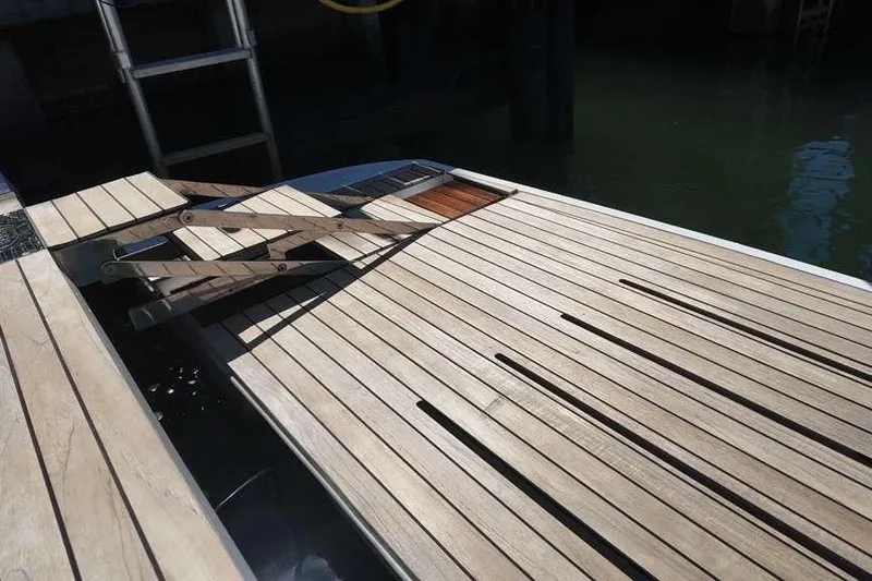  Yacht Photos Pics Teak deck of 2024 Sessa Marine C44 Cruiser with folding ladder.