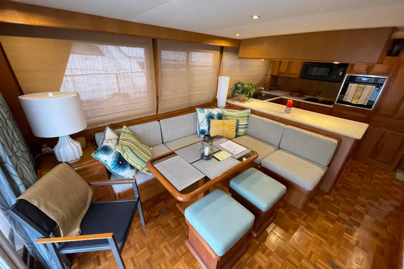 Moore Fun Yacht Photos Pics Luxurious interior of 1998 Ocean Alexander 486 Classico Pilothouse with cozy seating and modern kitchen.