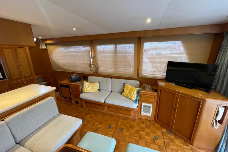 Moore Fun Yacht Photos Pics Luxurious interior of 1998 Ocean Alexander 486 Classico Pilothouse yacht with cozy seating and TV.