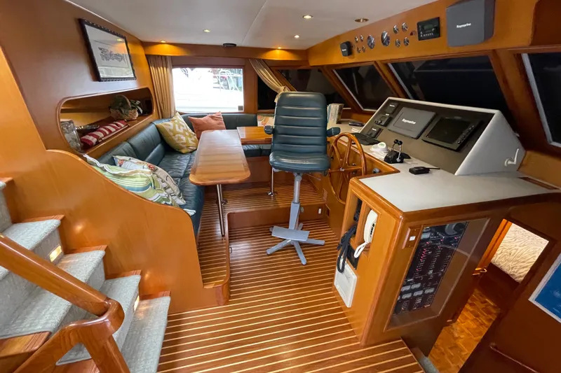 Moore Fun Yacht Photos Pics 1998 Ocean Alexander 486 Classico Pilothouse interior with helm, seating, and wood finishes.
