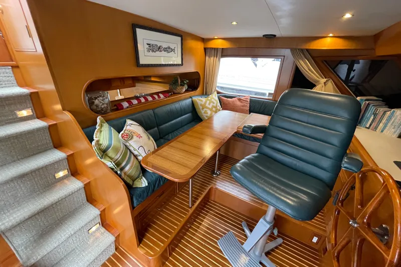 Moore Fun Yacht Photos Pics Interior of 1998 Ocean Alexander 486 Classico Pilothouse with seating and wooden accents.