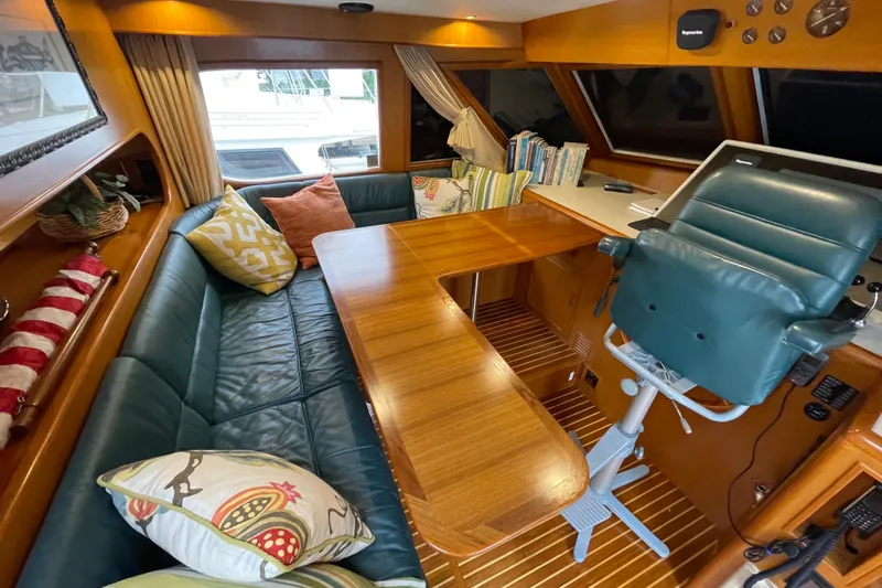 Moore Fun Yacht Photos Pics Luxurious 1998 Ocean Alexander 486 Classico Pilothouse interior with plush seating and elegant wood finishes.