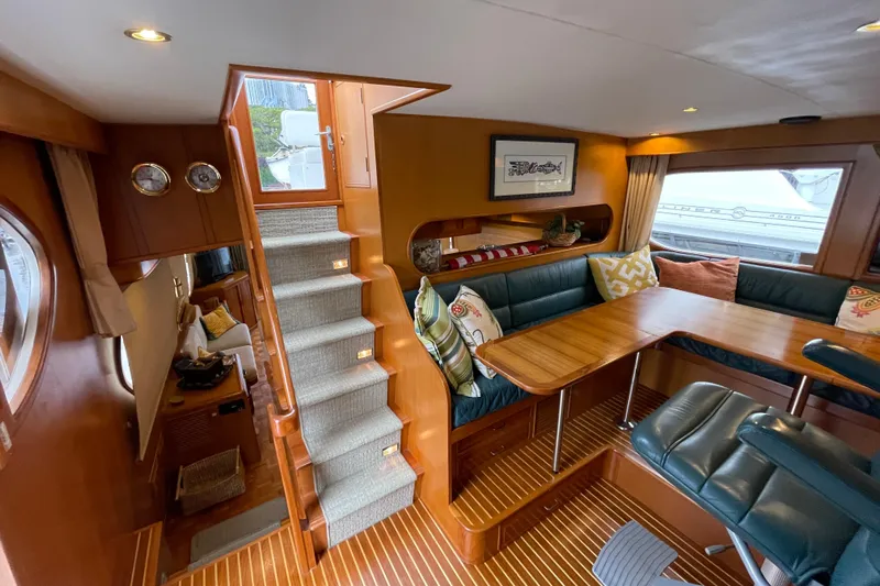 Moore Fun Yacht Photos Pics Luxurious 1998 Ocean Alexander 486 Classico Pilothouse interior with elegant wood finishes and cozy seating.