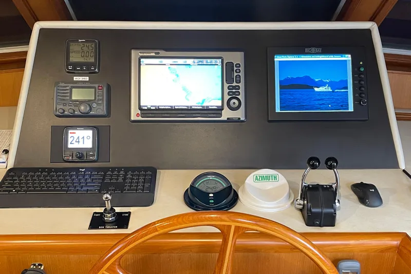 Moore Fun Yacht Photos Pics 1998 Ocean Alexander 486 Classico Pilothouse helm with navigation screens and controls.