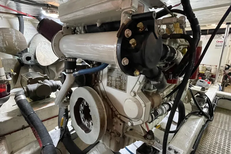 Moore Fun Yacht Photos Pics Engine room of 1998 Ocean Alexander 486 Classico Pilothouse yacht, showcasing mechanical components.