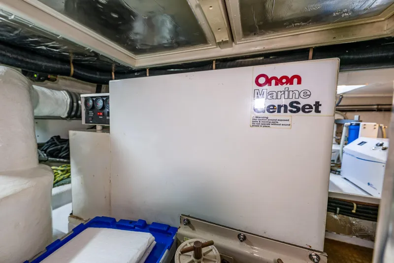 Moore Fun Yacht Photos Pics Engine room of 1998 Ocean Alexander 486 Classico Pilothouse with Onan Marine GenSet.